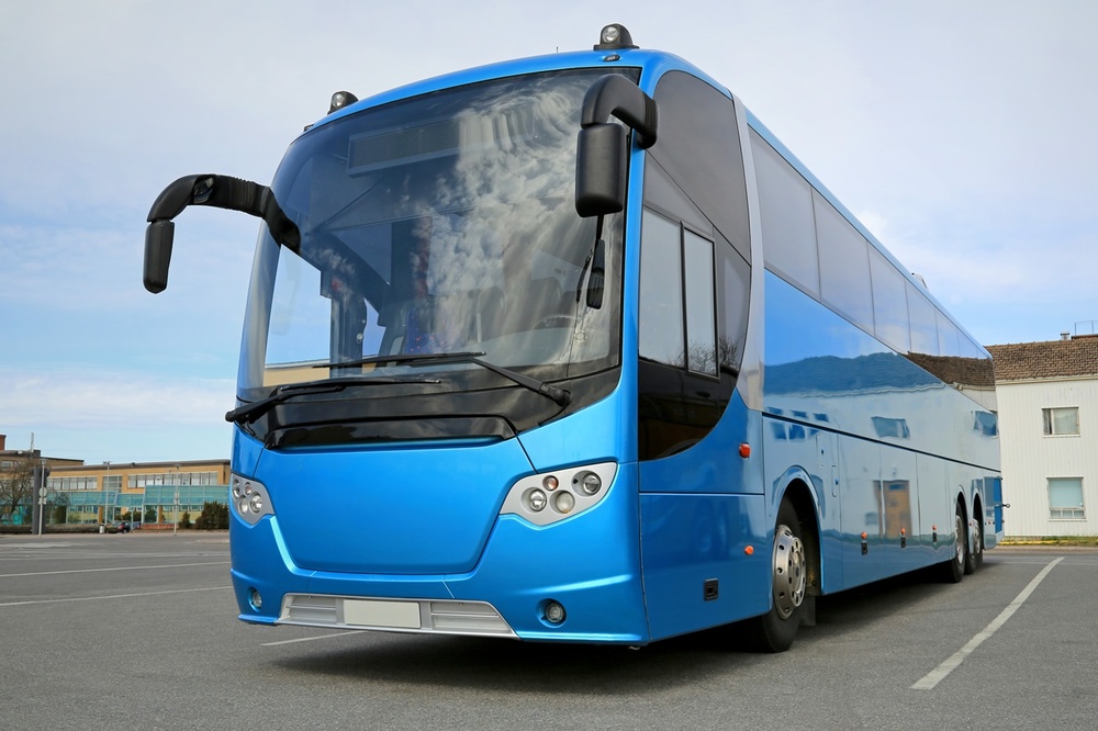 Blue coach in parking bay low res